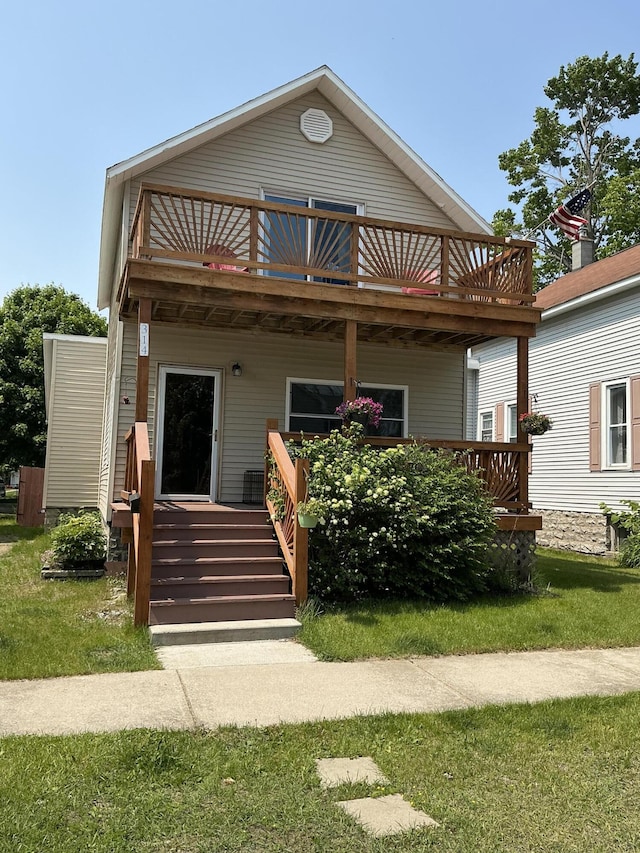 314 Sable St, Alpena, MI 49707 - view of front facade with a balcony and a porch