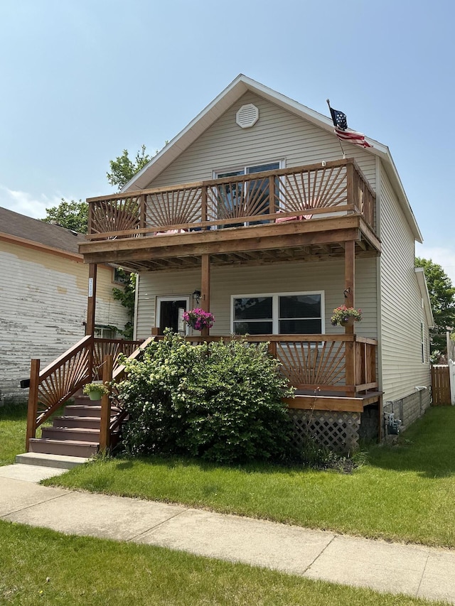 314 Sable St, Alpena, MI 49707 - view of front facade with a front yard, a balcony, and a deck