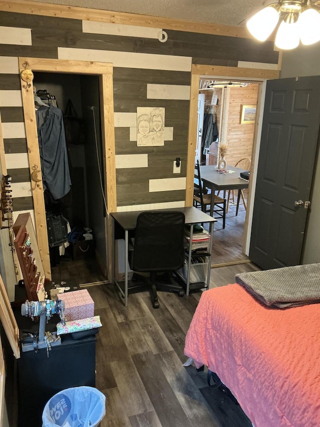 314 Sable St, Alpena, MI 49707 - bedroom with wood walls and wood finished floors