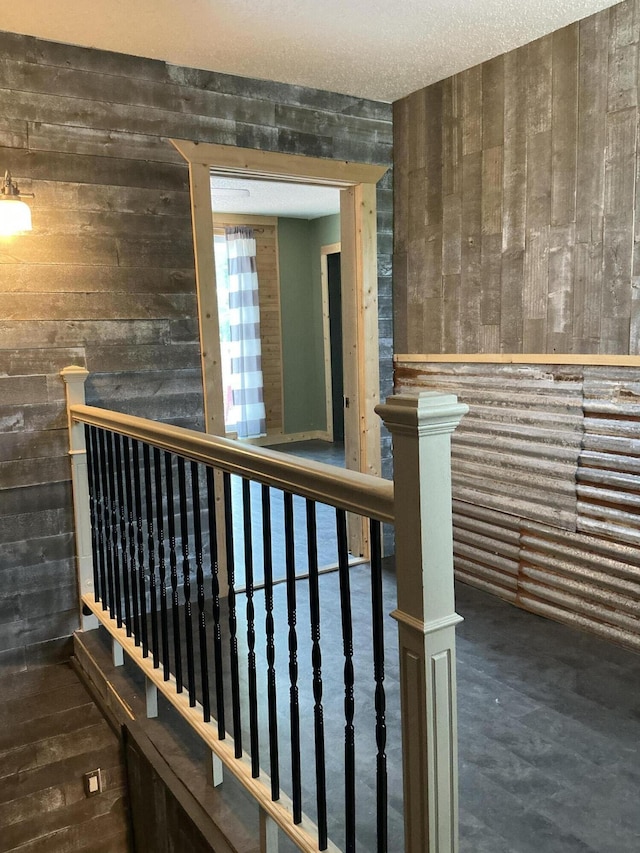 314 Sable St, Alpena, MI 49707 - staircase featuring wood walls and wood finished floors