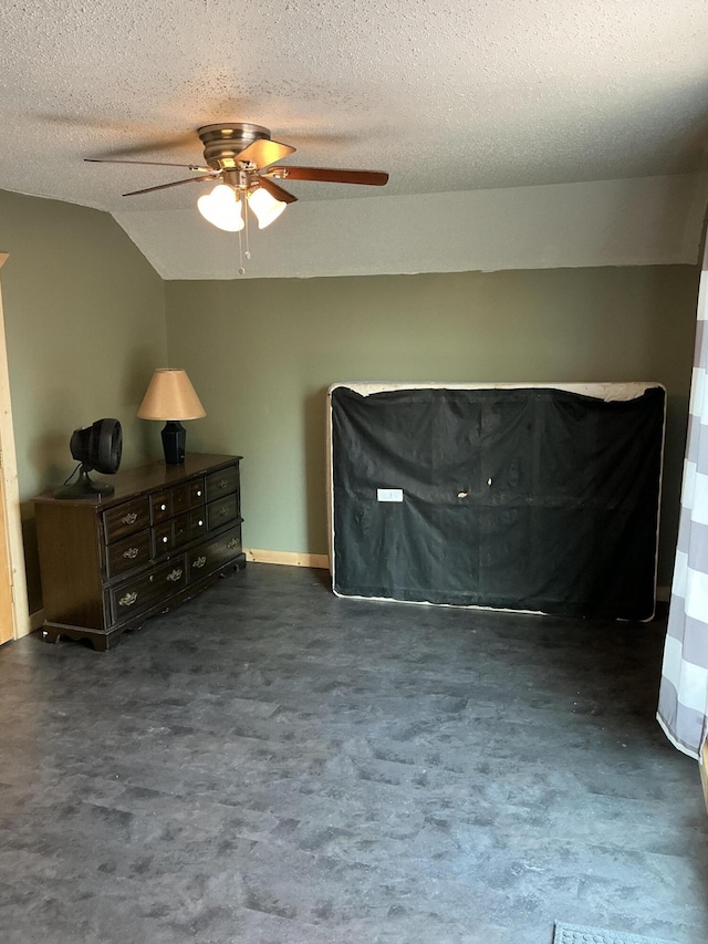 314 Sable St, Alpena, MI 49707 - bedroom featuring a textured ceiling, vaulted ceiling, and a ceiling fan