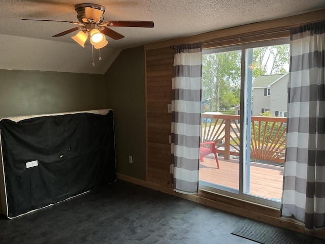 314 Sable St, Alpena, MI 49707 - bonus room featuring a ceiling fan, carpet flooring, lofted ceiling, and a textured ceiling
