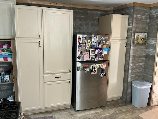 314 Sable St, Alpena, MI 49707 - below grade area featuring freestanding refrigerator and light wood finished floors