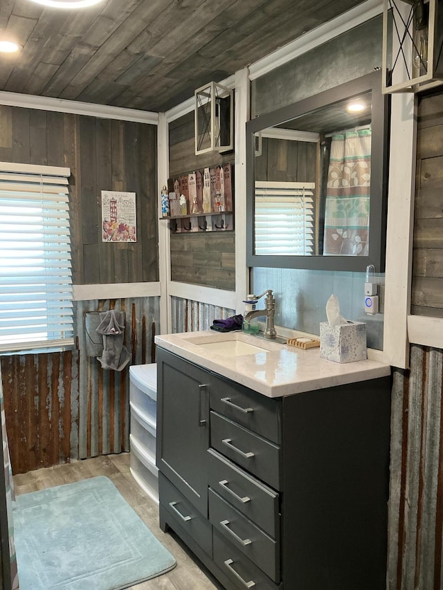 314 Sable St, Alpena, MI 49707 - bathroom with wooden ceiling, vanity, wooden walls, and wood finished floors