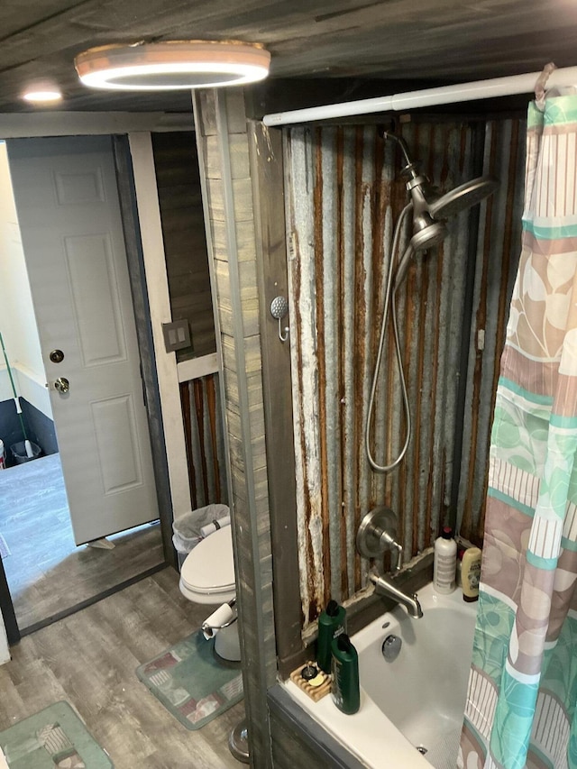 314 Sable St, Alpena, MI 49707 - full bath with wood finished floors and shower / tub combo with curtain