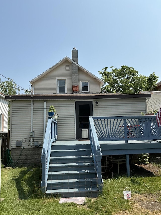 314 Sable St, Alpena, MI 49707 - back of house with a deck, a chimney, and stairway