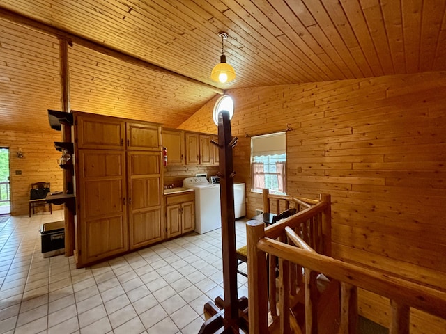 13333 S Black River Rd, Onaway, MI 49765 - kitchen featuring wood walls, vaulted ceiling, wooden ceiling, light tile patterned flooring, and pendant lighting