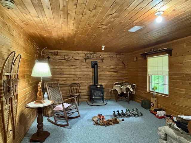 13333 S Black River Rd, Onaway, MI 49765 - sitting room with wooden ceiling, carpet, and a wood stove