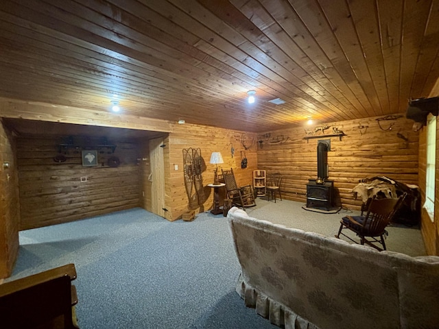 13333 S Black River Rd, Onaway, MI 49765 - living area with a wood stove, carpet flooring, and wooden ceiling