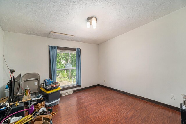7539 E M-32, Johannesburg, MI 49751 - home office featuring wood finished floors and a textured ceiling