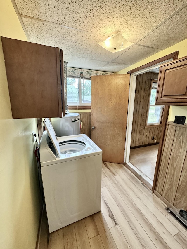 2833 S Horseshoe Trl, Grayling, MI 49738 - washroom with washer / dryer, cabinet space, and light wood-style flooring