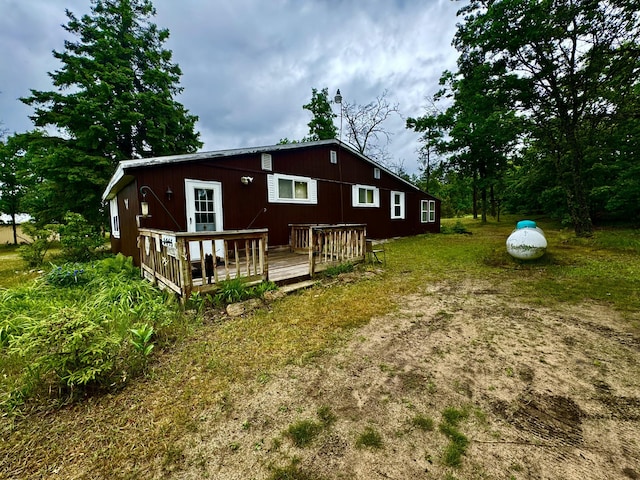 2833 S Horseshoe Trl, Grayling, MI 49738 - back of property with a wooden deck