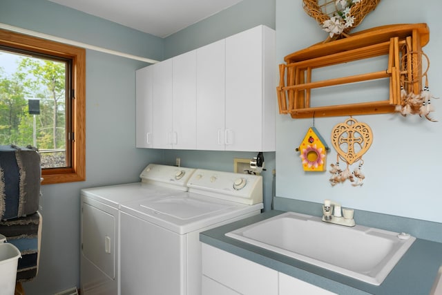 10134 Upper Mograin Rd, Cheboygan, MI 49721 - laundry room with cabinet space and washer and clothes dryer