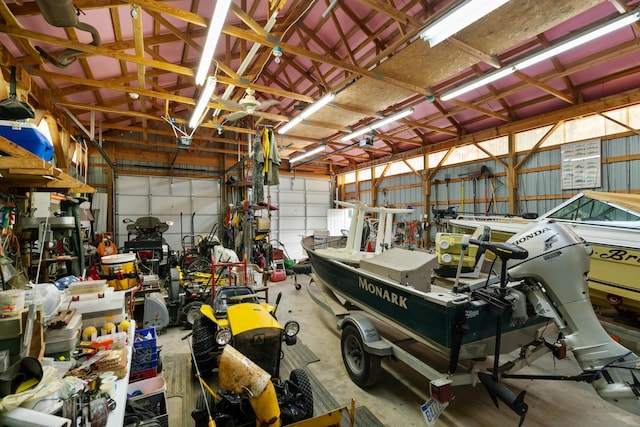 10134 Upper Mograin Rd, Cheboygan, MI 49721 - garage featuring a workshop area and metal wall