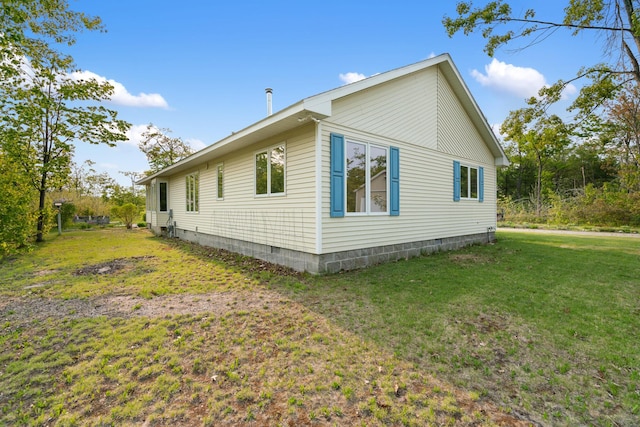 10134 Upper Mograin Rd, Cheboygan, MI 49721 - view of home's exterior featuring a yard