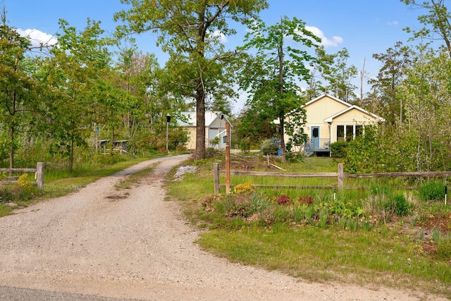 10134 Upper Mograin Rd, Cheboygan, MI 49721 - view of front of home with dirt driveway