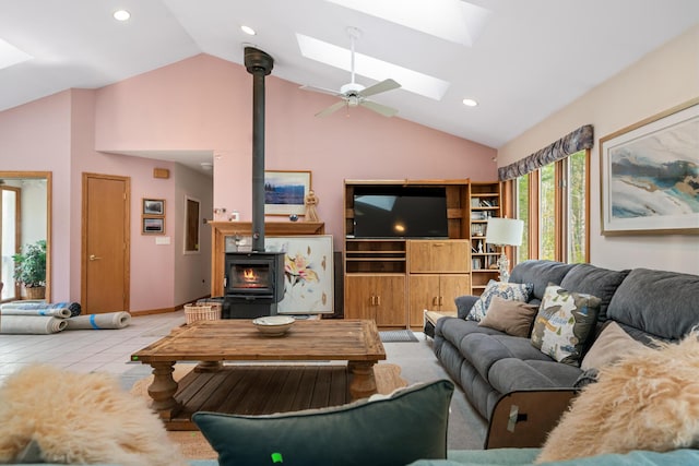 10134 Upper Mograin Rd, Cheboygan, MI 49721 - living area featuring a wood stove, a skylight, high vaulted ceiling, recessed lighting, and a ceiling fan