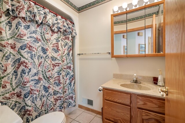 10134 Upper Mograin Rd, Cheboygan, MI 49721 - bathroom with vanity, tile patterned floors, and a shower with shower curtain