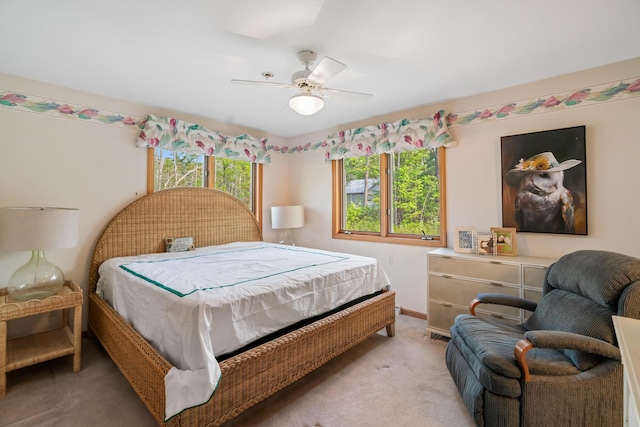 10134 Upper Mograin Rd, Cheboygan, MI 49721 - bedroom with light colored carpet and ceiling fan