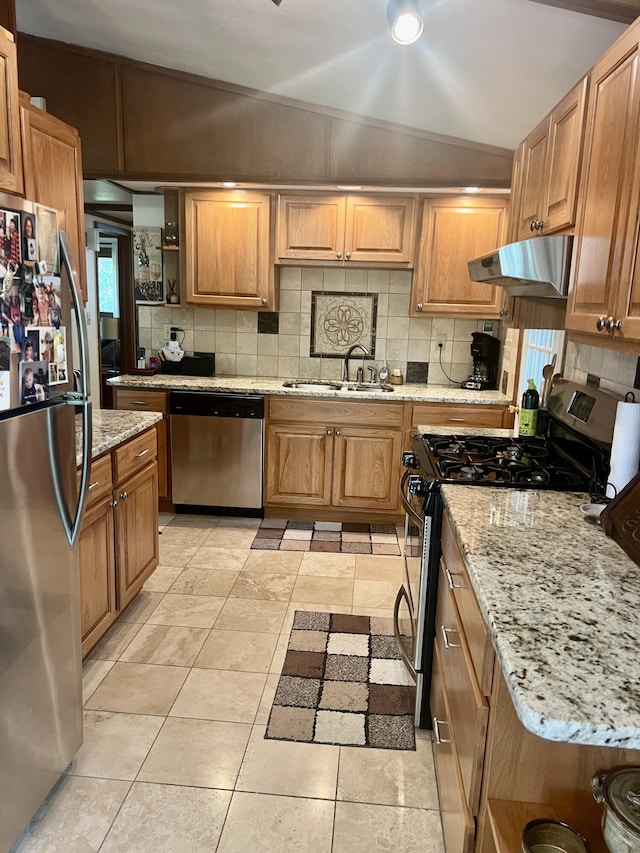 268 Yorke Trl, Grayling, MI 49738 - kitchen with stainless steel appliances, under cabinet range hood, backsplash, and light stone countertops