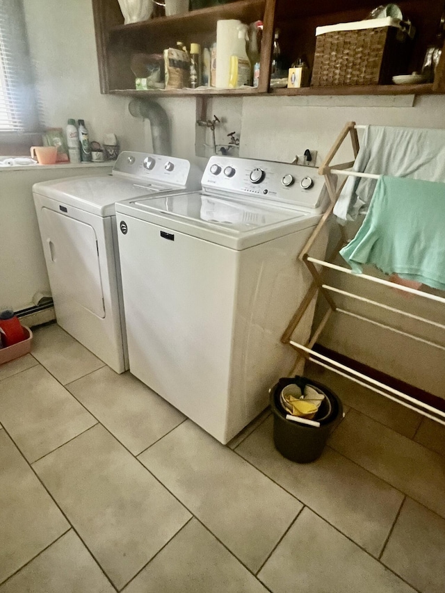 268 Yorke Trl, Grayling, MI 49738 - laundry area with independent washer and dryer and light tile patterned floors