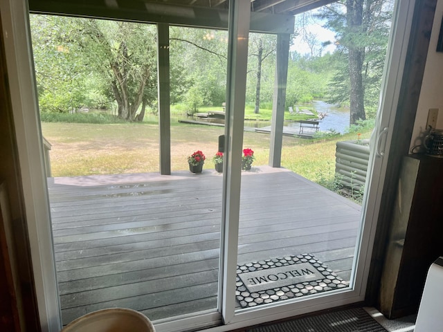 268 Yorke Trl, Grayling, MI 49738 - doorway to outside with a water view and view of scattered trees
