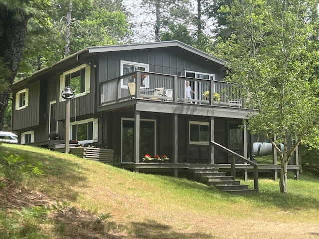 268 Yorke Trl, Grayling, MI 49738 - rear view of property with a lawn and a deck