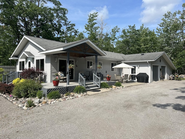 2131 Big Buck Dr, Lewiston, MI 49756 - view of front of home with roof with shingles and a garage