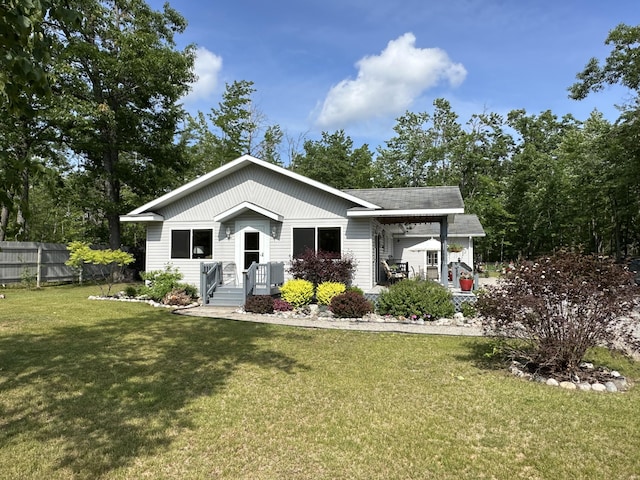 2131 Big Buck Dr, Lewiston, MI 49756 - view of front facade featuring a shingled roof