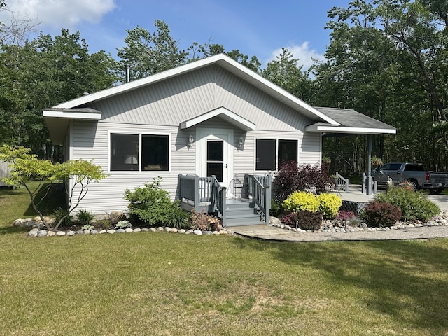 2131 Big Buck Dr, Lewiston, MI 49756 - view of front of property with a front lawn
