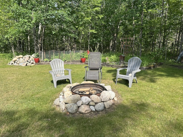 2131 Big Buck Dr, Lewiston, MI 49756 - view of green lawn featuring a fire pit