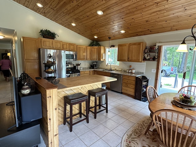 2131 Big Buck Dr, Lewiston, MI 49756 - kitchen featuring stainless steel appliances, wooden ceiling, vaulted ceiling, backsplash, and light tile patterned floors