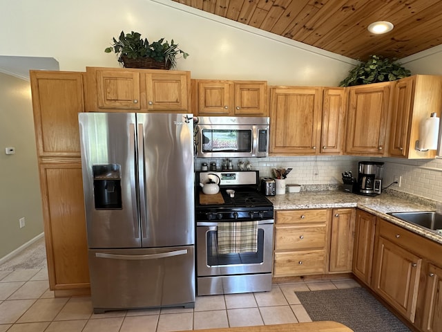 2131 Big Buck Dr, Lewiston, MI 49756 - kitchen featuring stainless steel appliances, lofted ceiling, light tile patterned flooring, wooden ceiling, and decorative backsplash