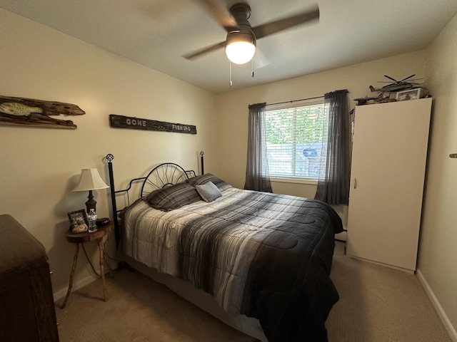 2131 Big Buck Dr, Lewiston, MI 49756 - bedroom with carpet floors and a ceiling fan