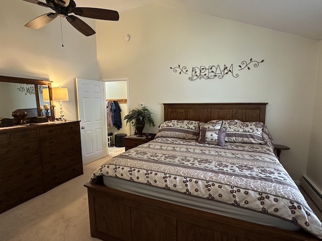 2131 Big Buck Dr, Lewiston, MI 49756 - bedroom with light colored carpet, lofted ceiling, baseboard heating, and a ceiling fan