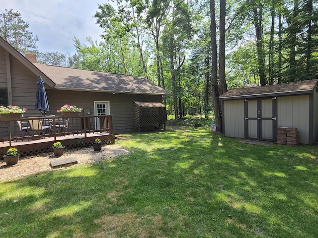 1514 Opal Lake Rd, Gaylord, MI 49735 - view of green lawn with a shed and a wooden deck