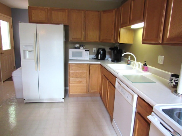 201 White Deer Trl, Prudenville, MI 48651 - kitchen with white appliances, light countertops, and brown cabinets