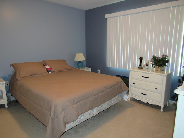 201 White Deer Trl, Prudenville, MI 48651 - bedroom featuring light carpet