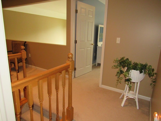 201 White Deer Trl, Prudenville, MI 48651 - hallway featuring light colored carpet and an upstairs landing