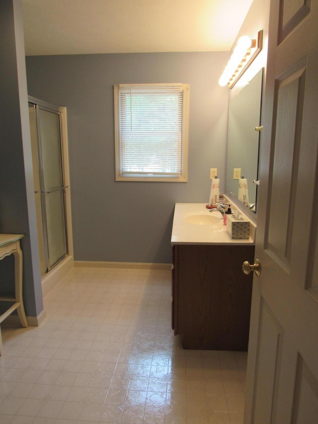 201 White Deer Trl, Prudenville, MI 48651 - bathroom featuring vanity and a shower with shower door