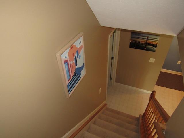 201 White Deer Trl, Prudenville, MI 48651 - stairs featuring baseboards and tile patterned floors