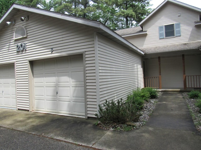 201 White Deer Trl, Prudenville, MI 48651 - view of side of home featuring a garage