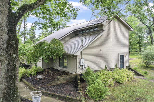 1655 Arrowhead Trl, West Branch, MI 48661 - view of property exterior with a metal roof