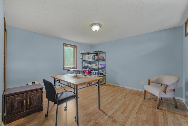 1655 Arrowhead Trl, West Branch, MI 48661 - office featuring light wood-type flooring and a textured ceiling