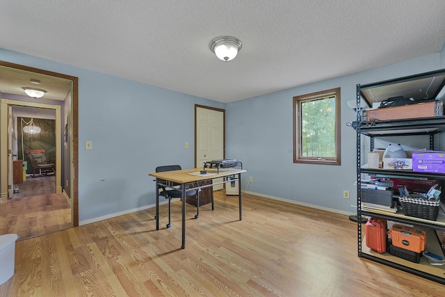 1655 Arrowhead Trl, West Branch, MI 48661 - office featuring light wood finished floors and a textured ceiling