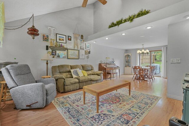 1655 Arrowhead Trl, West Branch, MI 48661 - living area featuring ceiling fan, a chandelier, light wood finished floors, recessed lighting, and high vaulted ceiling
