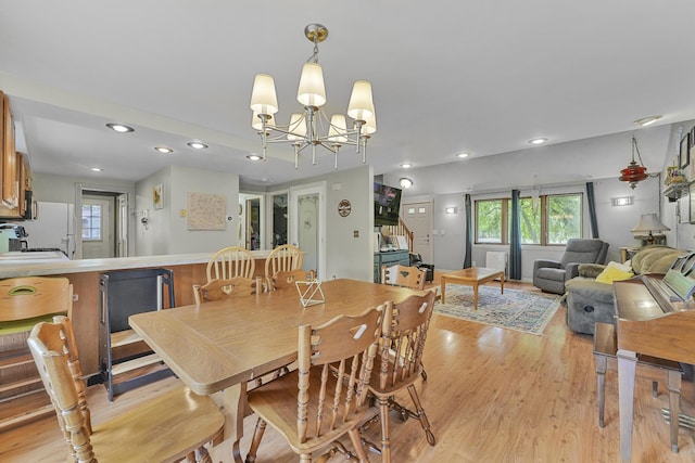 1655 Arrowhead Trl, West Branch, MI 48661 - dining room featuring stairs, light wood finished floors, recessed lighting, and a chandelier