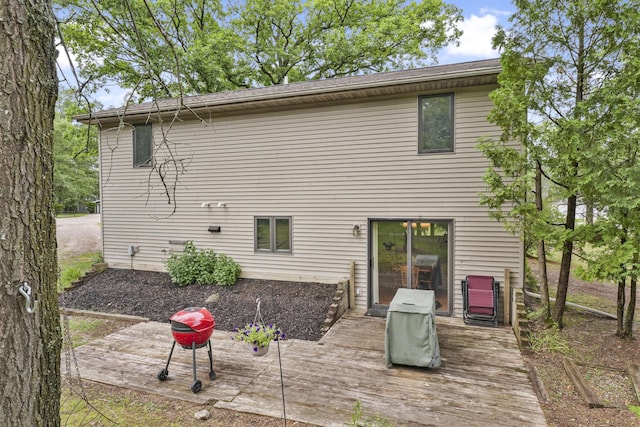 1655 Arrowhead Trl, West Branch, MI 48661 - back of house featuring a wooden deck