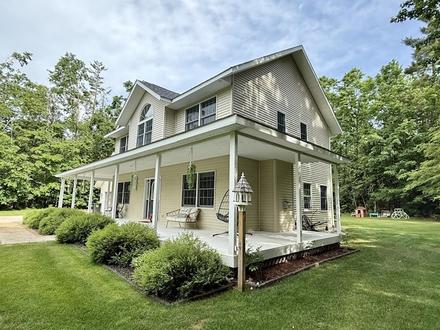 2176 Deepwoods Dr, Gaylord, MI 49735 - view of front of house with a front yard and covered porch