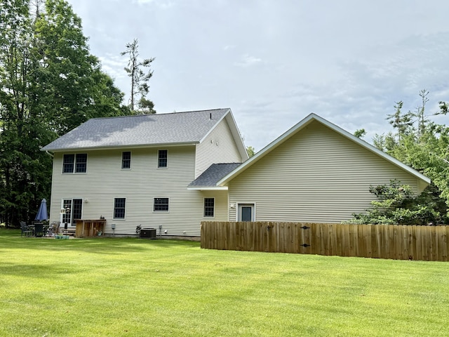2176 Deepwoods Dr, Gaylord, MI 49735 - back of house featuring a shingled roof